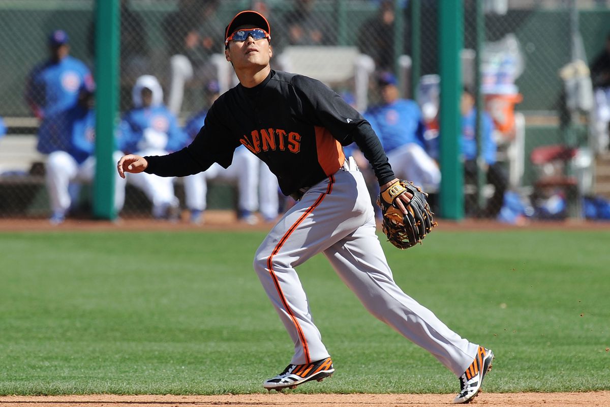 Kensuke Tanaka fields a ground ball to his left - Photo credit