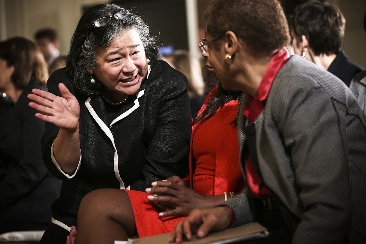 Tina Tchen, then Assistant to President Obama, (left) talks to Rep. Eleanor Holmes Norton (D-DC) during an event marking the 50th anniversary of the Equal Pay Act on June 10, 2013