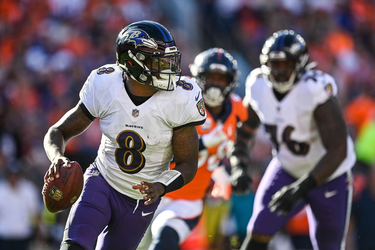 Lamar Jackson #8 of the Baltimore Ravens rolls out of the pocket in the third quarter of a game against the Denver Broncos at Empower Field at Mile High on October 3, 2021 in Denver, Colorado.