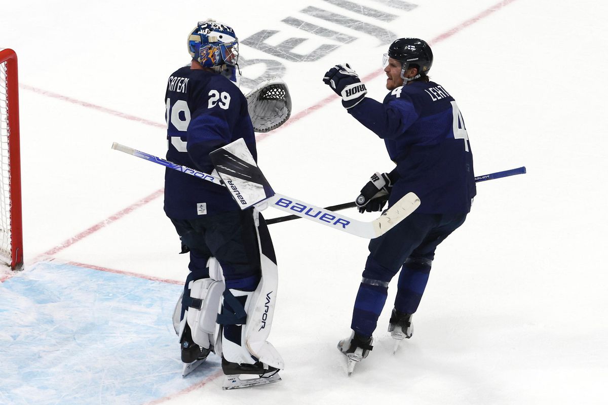 Harri Sateri #29 and Mikko Lethonen #4 of Team Finland celebrate the victory during the Men’s Ice Hockey Playoff Semifinal match between Team Finland and Team Slovakia on Day 14 of the Beijing 2022 Winter Olympic Games at National Indoor Stadium on February 18, 2022 in Beijing, China.