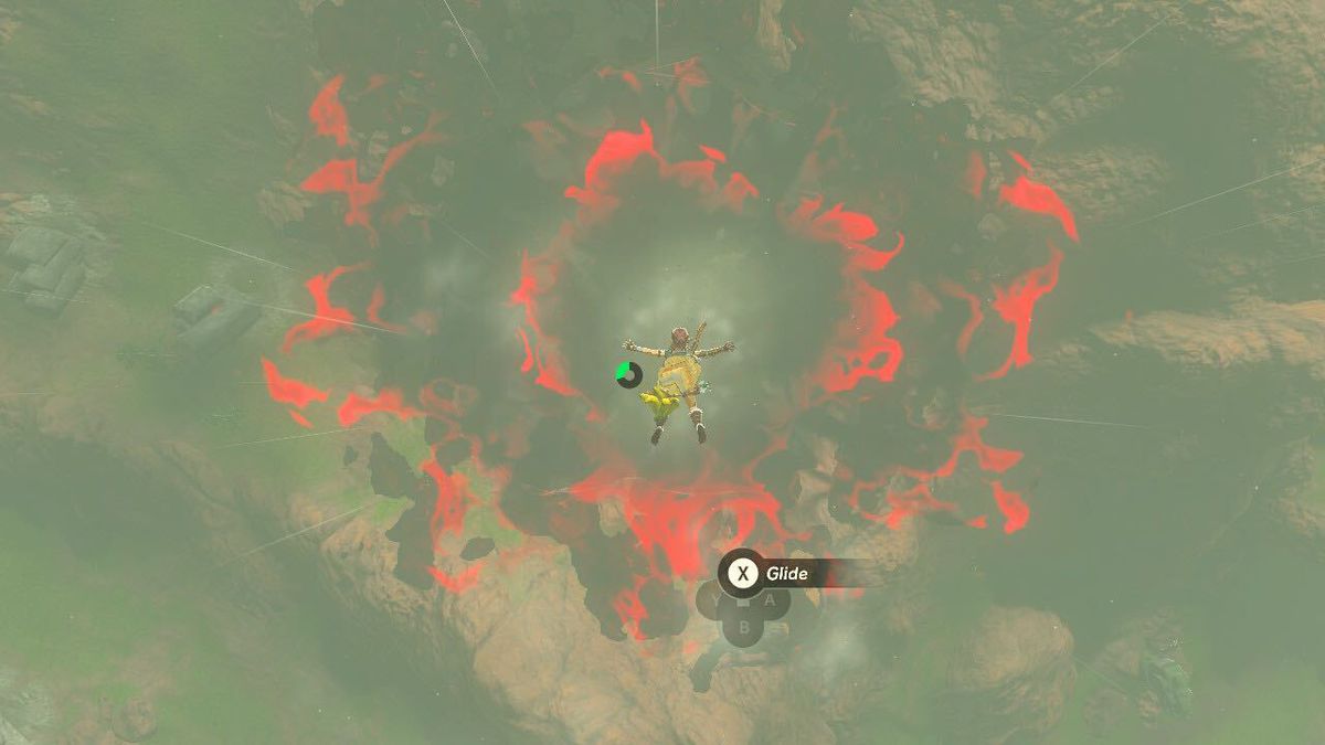 Link skydives toward a chasm, a glowing red hole in the ground in Hyrule that will allow him access to the Depths, in The Legend of Zelda: Tears of the Kingdom