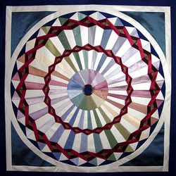 This undated photo provided by Stacey Sharman, of Berkeley, Calif., shows her "Carnival" quilt made with neckties.