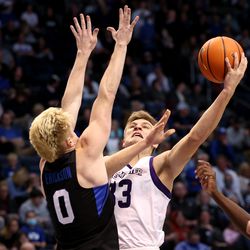 Brigham Young Cougars guard Hunter Erickson (0) defends Westminster Griffins guard Drake Middleton (33) as BYU and Westminister play at the Marriott Center in Provo on Wednesday, Dec. 29, 2021.