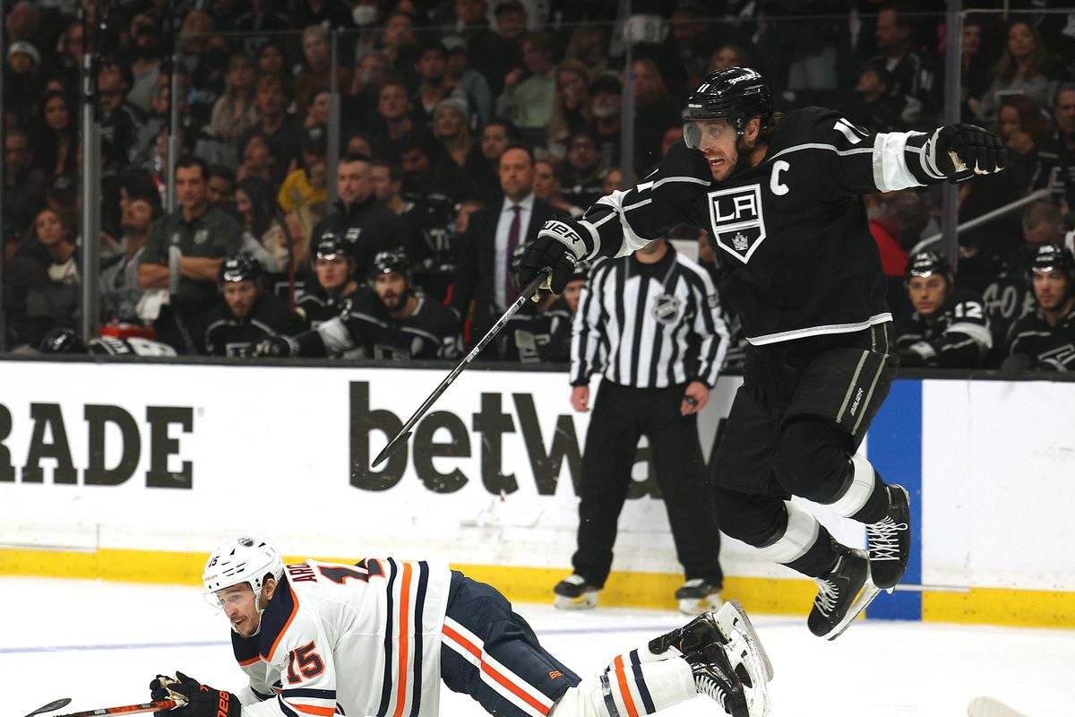 Anze Kopitar of the Los Angeles Kings reacts as he jumps over Josh Archibald of the Edmonton Oilers during the first period in Game Six of the First Round of the 2022 Stanley Cup Playoffs at Crypto.com Arena on May 12, 2022 in Los Angeles, California.