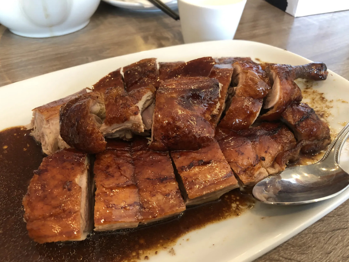 Plate of half a roast duck sliced from Eastern Dynasty.