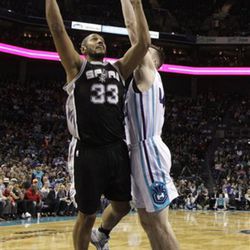 San Antonio Spurs' Boris Diaw (33) shoots against the Charlotte Hornets during the second half of an NBA basketball game in Charlotte, N.C., Monday, March 21, 2016. The Hornets won 91-88. (AP Photo/Chuck Burton)