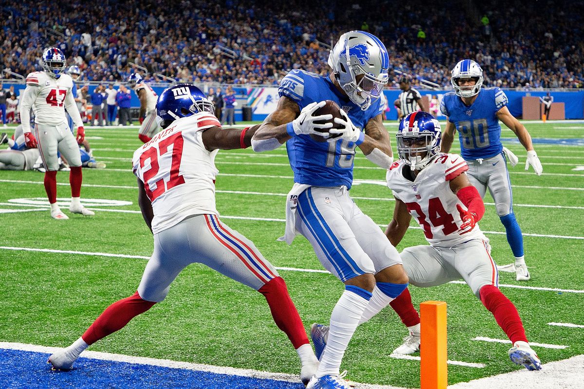 Kenny Golladay of the Detroit Lions makes the touchdown catch as Deandre Baker and Grant Haley of the New York Giants defend during the third quarter of the game at Ford Field on October 27, 2019 in Detroit, Michigan.