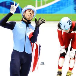 Short-track speedskater Apolo Anton Ohno shows seven fingers, the number of Olympic medals he's won.