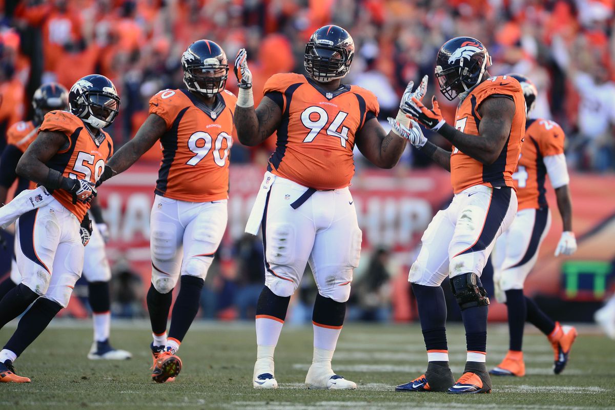 Knighton, who will be switching from #94 to #98 in 2014, celebrates a sack in the 2013 AFC Championship.