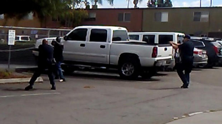 Alfred Olango appears to aim an object at a police officer moments before he's shot and killed.