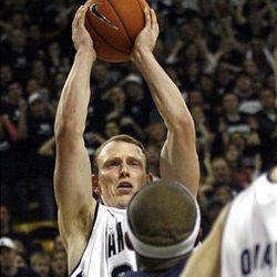 Utah State's Tyler Newbold grabs the rebound during a basketball game against Nevada at the Dee Glen Smith Spectrum in Logan Saturday. The Aggies defeated the Wolfpack 76-65.