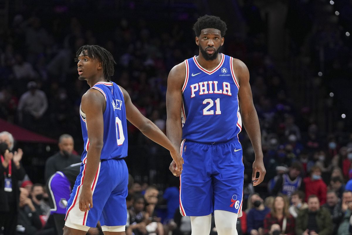 Tyrese Maxey #0 and Joel Embiid #21 of the Philadelphia 76ers celebrate against the Sacramento Kings at the Wells Fargo Center on January 29, 2022 in Philadelphia, Pennsylvania. The 76ers defeated the Kings 103-101.&nbsp;