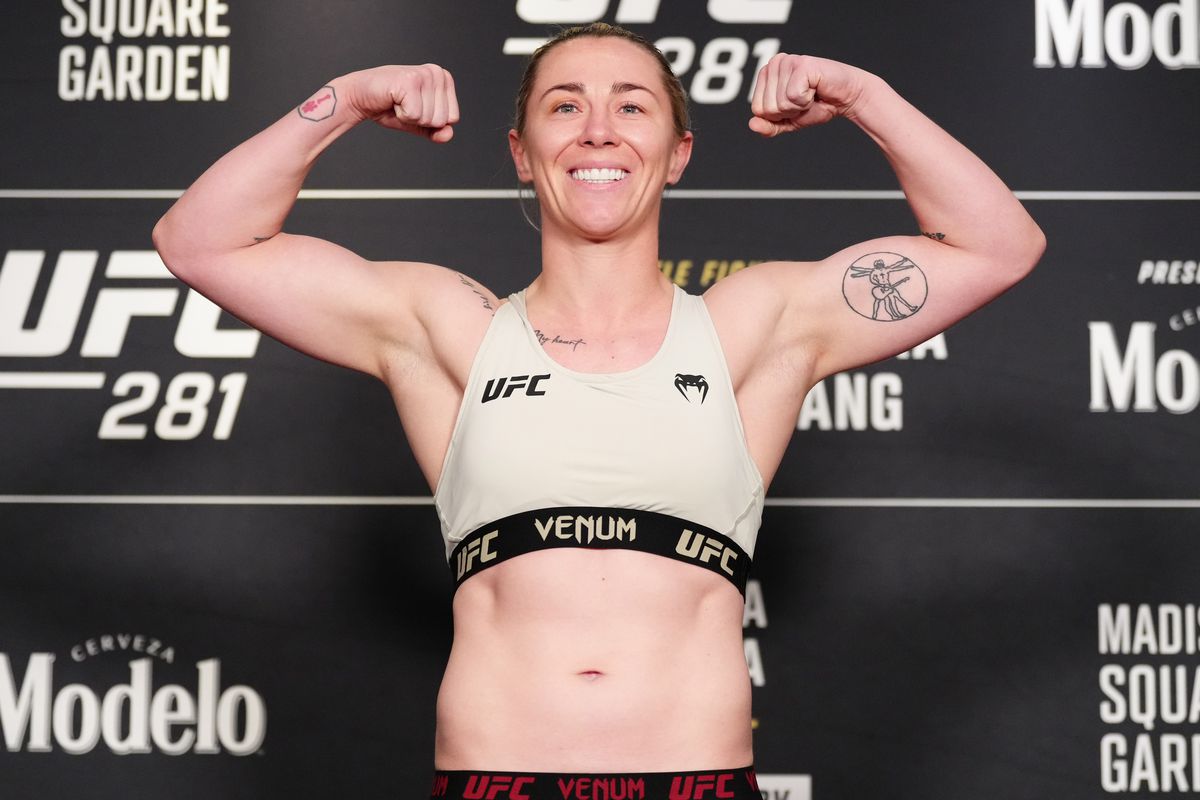 Molly McCann of England poses on the scale during the UFC 281 official weigh-in at the Marriott Marquis Hotel on November 11, 2022 in New York City.