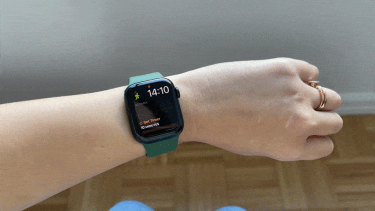 A gif of a person shaking their wrist and the Assistive Touch outline appearing. 