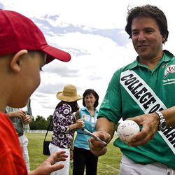 Harrison  Hoskins, 7, of Layton, gets an autograph from Santiago Mendez of the winning Dean's Demons polo team Saturday in South Jordan at the Pharmacy Cup. 