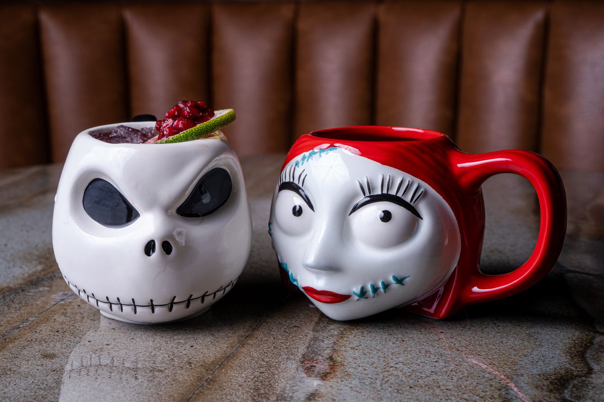 Two mugs modeled after Nightmare Before Christmas characters.