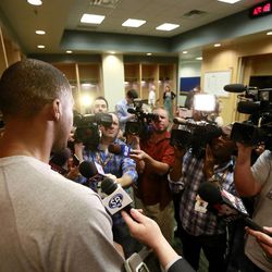 Utah Jazz power forward Derrick Favors speaks with the media as Jazz players clean out their lockers for the season in Salt Lake City Thursday, April 17, 2014.