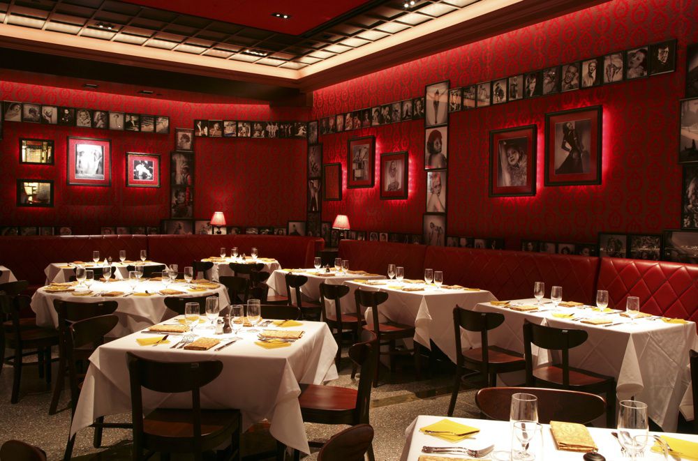 Dim restaurant interior with red furnishings 