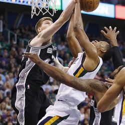 Utah Jazz guard Rodney Hood (5)  is blocked by San Antonio Spurs forward Davis Bertans (42) during NBA action in Salt Lake City on Friday, Nov. 4, 2016.