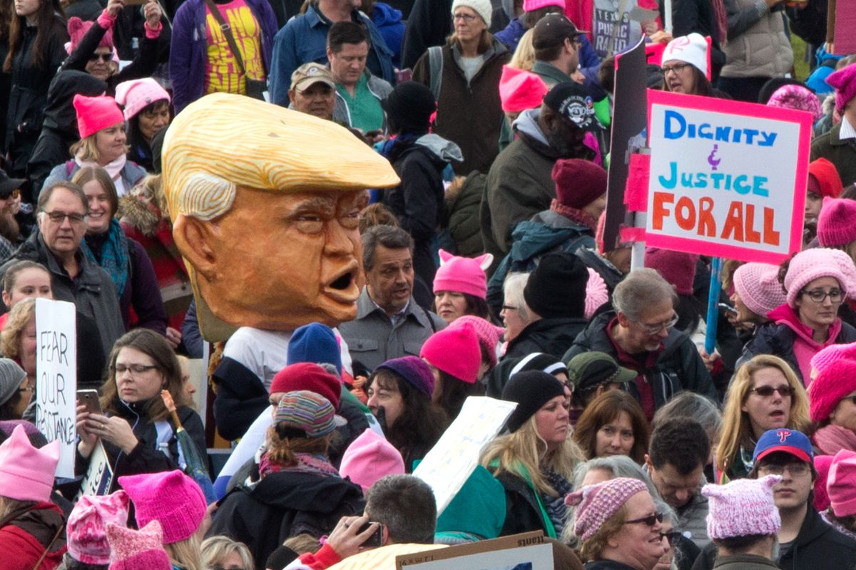 Thousands march in the Women's March in Seattle a day after the inauguration of President Donald Trump. 