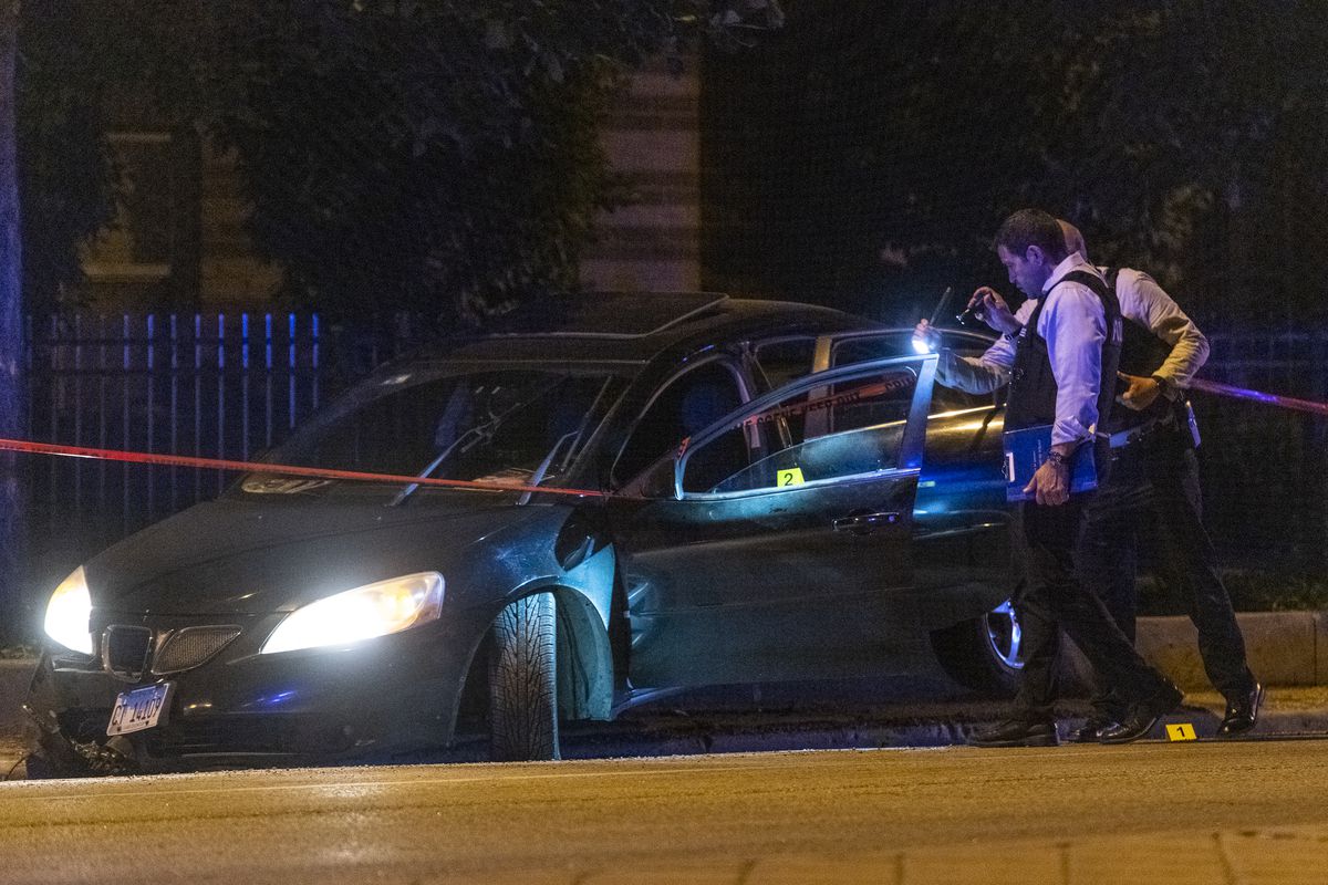 Chicago police work the scene where 24-year-old man was shot and killed in the 1300 block of W Roosevelt Road, in the University Village neighborhood, Friday, June 4, 2021.