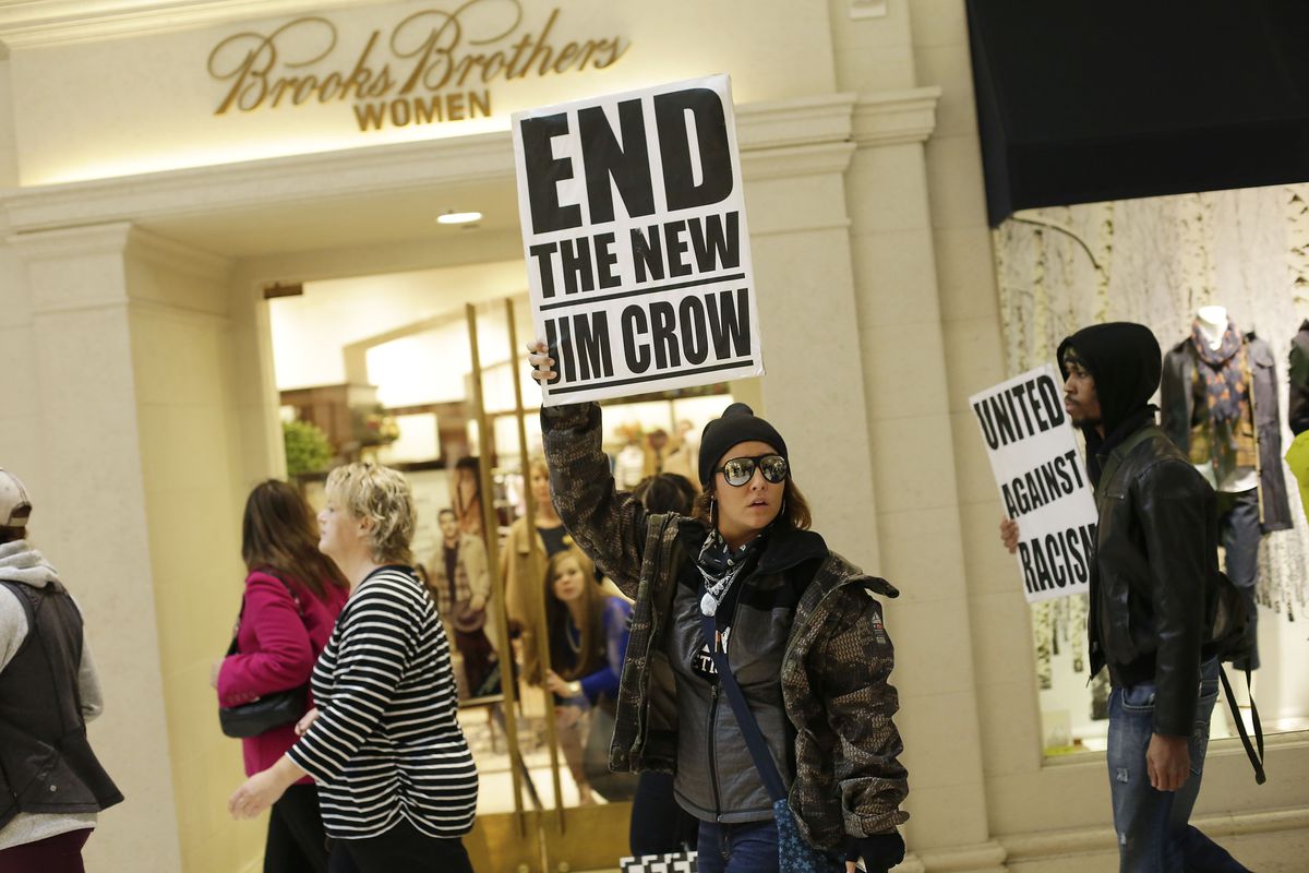 Ferguson protesters walk through a St. Louis shopping mall while calling for justice for Michael Brown.