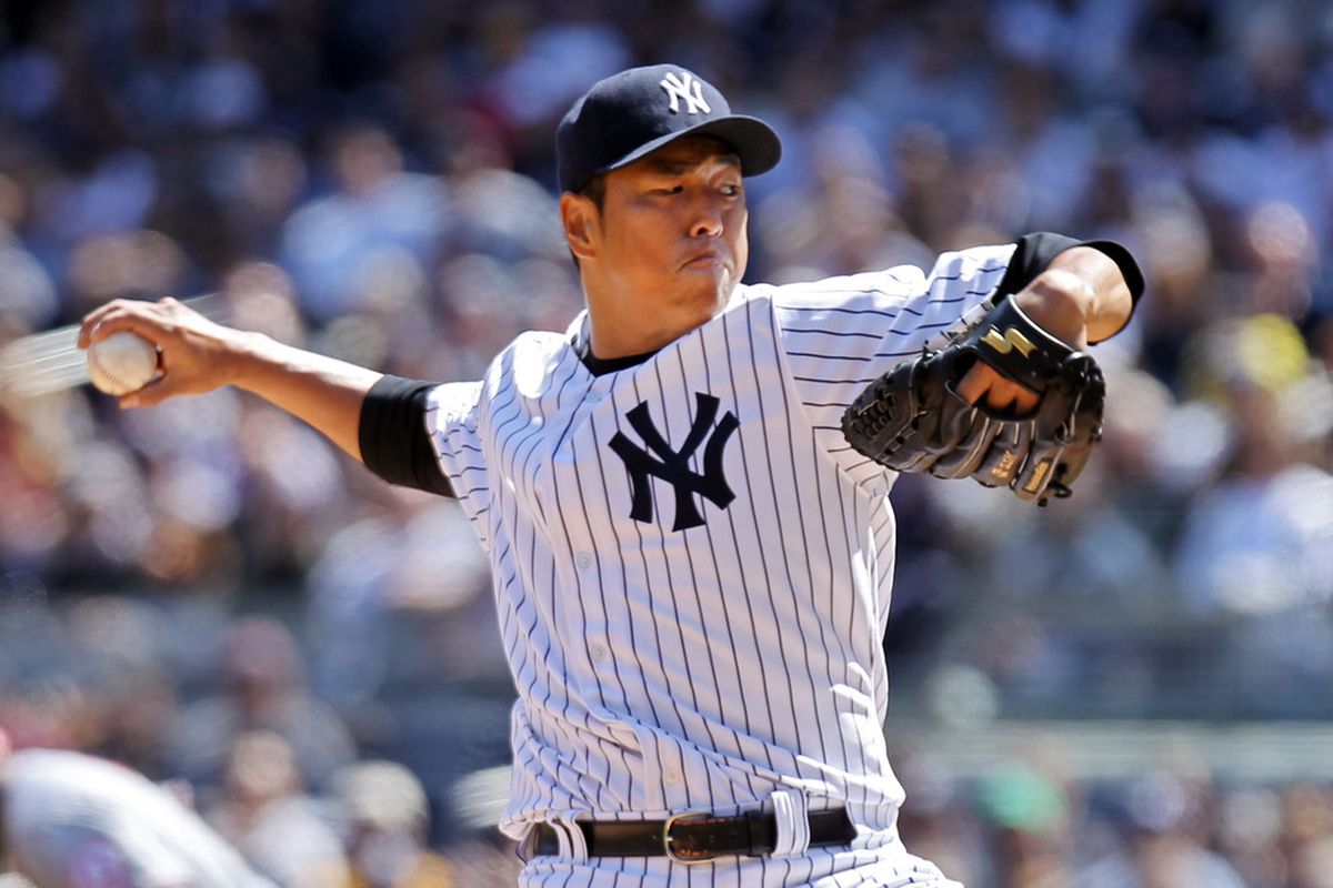 NEW YORK, NY - APRIL 13:  Hiroki Kuroda #18 of the New York Yankees pitches against the Los Angeles Angels during the home opener at Yankee Stadium on April 13, 2012 in the Bronx borough of New York City.  (Photo by Nick Laham/Getty Images)