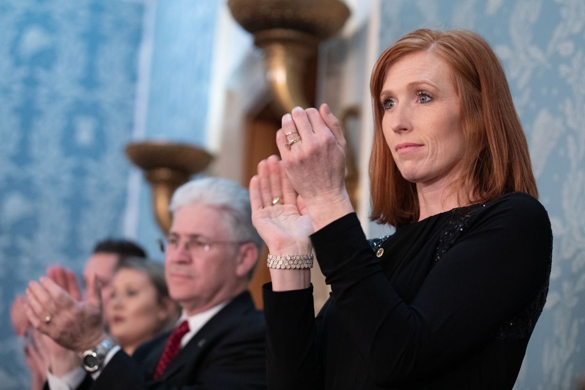 Jennie Taylor applauds as President Donald Trump gives his State of the Union address to a joint session of Congress on Tuesday, Feb. 5, 2019, at the Capitol in Washington, D.C.
