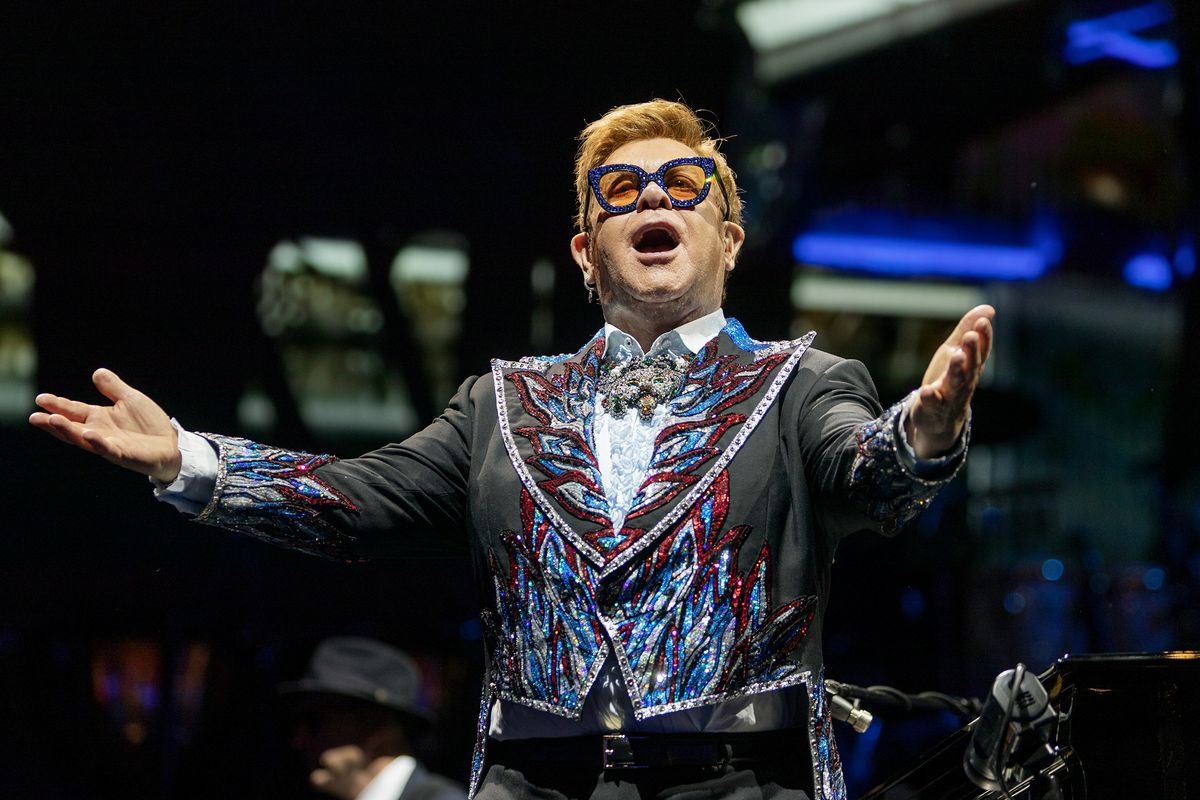 Elton John stands and gestures out at the audience as he performs at Vivint Smart Home Arena in Salt Lake City on Wednesday, Sept. 4, 2019.