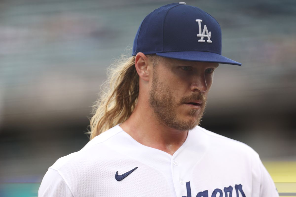 Noah Syndergaard of the Los Angeles Dodgers reacts as he comes to the dugout at the end of the fifth inning against the Washington Nationals at Dodger Stadium on May 31, 2023 in Los Angeles, California.
