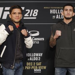 Henry Cejudo and Sergio Pettis pose at UFC 218 media day.