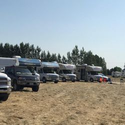 Recreational vehicles are parked in a grassy field in Rigby, Idaho, as a crowd of eclipse enthusiasts await the natural phenomenon to unfold on Monday, Aug. 21, 2017.