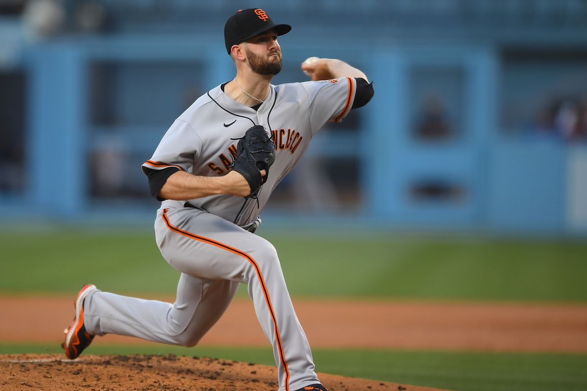 Alex Wood #57 of the San Francisco Giants pitches in the game against the Los Angeles Dodgers at Dodger Stadium on July 20, 2021 in Los Angeles, California.