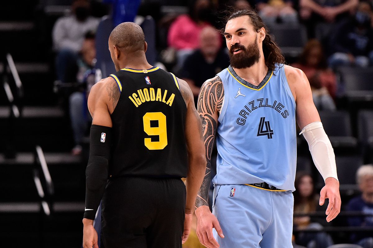 Andre Iguodala #9 of the Golden State Warriors and Steven Adams #4 of the Memphis Grizzlies during the second half at FedExForum on March 28, 2022 in Memphis, Tennessee.