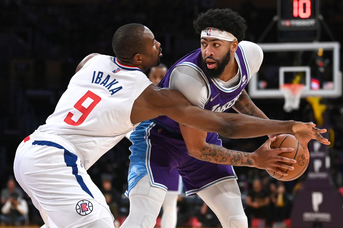 Los Angeles Clippers center Serge Ibaka (9) guards Los Angeles Lakers forward Anthony Davis (3) in the first half of the game at Staples Center.