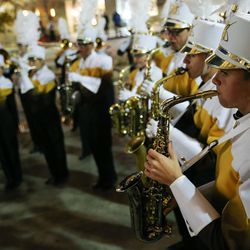 The Davis High School band performs during an unveiling celebration for the Macy's holiday candy windows at the City Creek Center in Salt Lake City on Thursday, Nov. 17, 2016.