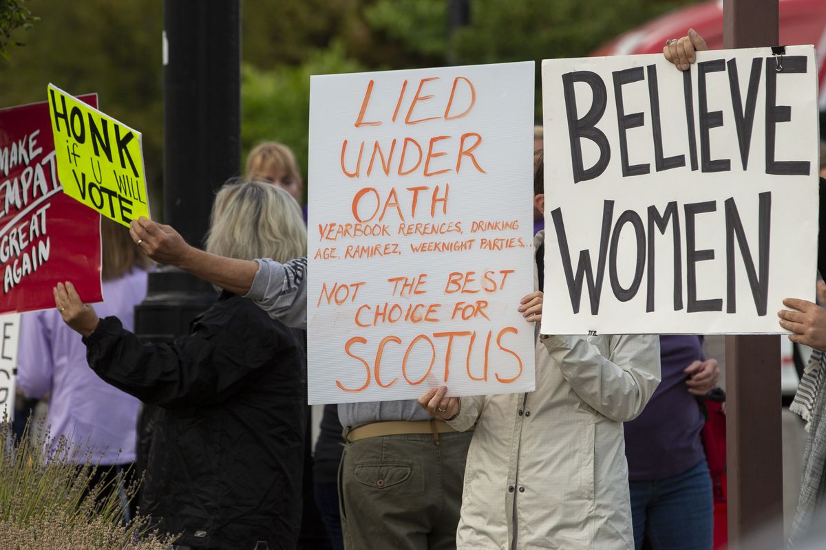 A small group of protestors gather at the Wallace F. Bennett Federal Building in Salt Lake City to protest the nomination of Brett Kavanaugh to the U.S. Supreme Court on Wednesday, Oct. 3, 2018.