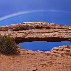 Mesa Arch with a rainbow in Canyonlands National Park near Moab, Utah.