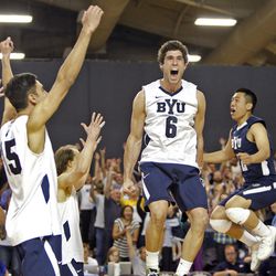 BYU's Josue Rivera (6) and teammates celebrate as Brigham Young University defeats Long Beach State 3-0 in men's volleyball to gain an automatic bid to the NCAA final on Saturday, April 27, 2013, in Provo.  
