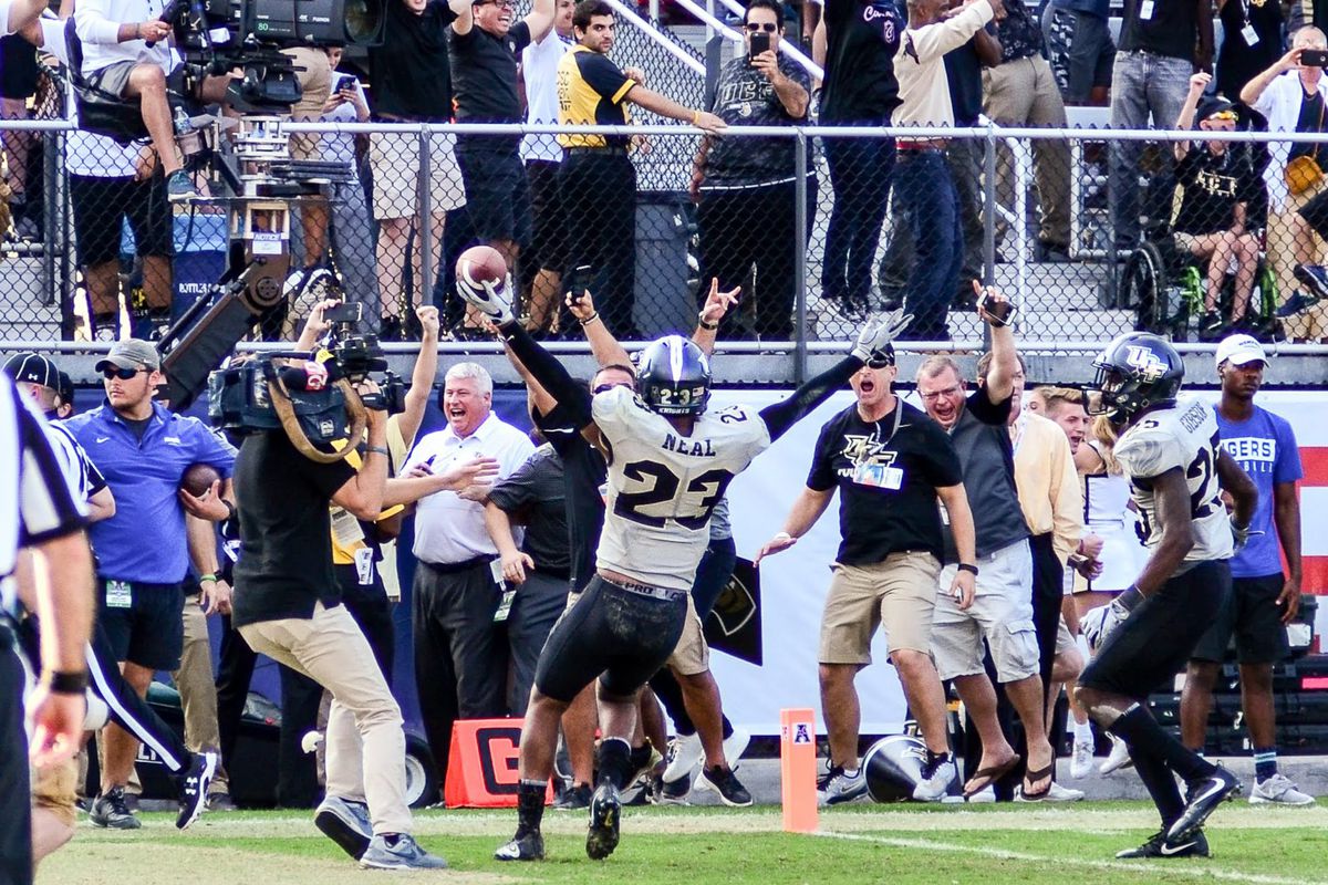 Tre Neal celebrates intercepting the final pass of the American Athletic Championship Game against Memphis. Photo: Derek Warden)