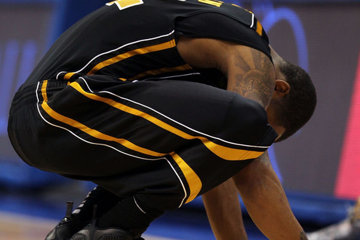 LAWRENCE, KS - FEBRUARY 25:  Marcus Denmon #12 of the Missouri Tigers reacts during the game against the Kansas Jayhawks on February 25, 2012 at Allen Fieldhouse in Lawrence, Kansas.  (Photo by Jamie Squire/Getty Images)