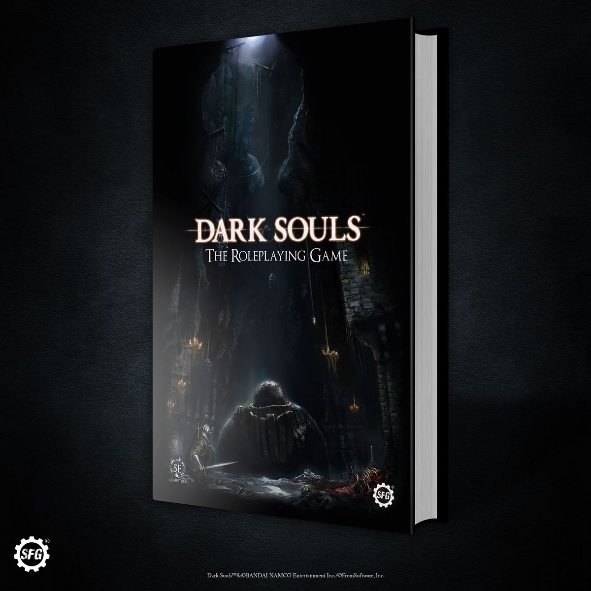 A render of the cover art for Dark Souls: The Roleplaying Game shows a knight moving into a darkened shrine. A bonfire glows to one side.
