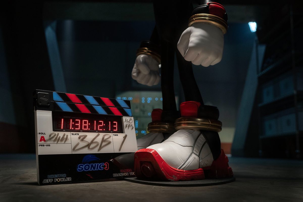 A clapboard for Sonic the Hedgehog 3 next to the Shadow’s foot