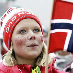 Stine-Merit Svello of Norway cheers during a men's snowboard cross event Monday at the Vancouver 2010 Olympics.