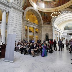 Woods Cross Police Sgt. Adam Osoro speaks during a press conference held by the Utah Domestic Violence Coalition at the Capitol in Salt Lake City, Monday, Feb. 9, 2015. At left is Woods Cross Police Chief Greg Butler.