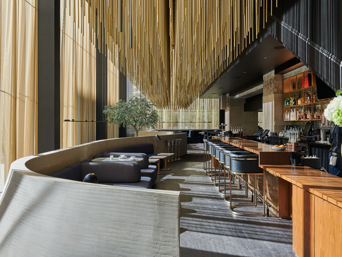 Guard and Grace’s interior, with an installation of more than 5,000 bronze rods that hang over the dining and bar area.