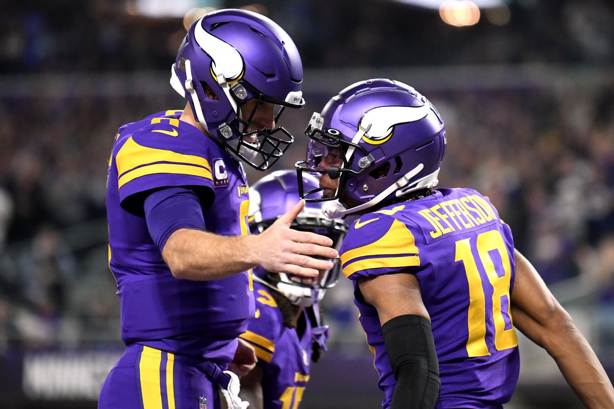 Justin Jefferson #18 of the Minnesota Vikings reacts after scoring a touchdown with teammate Kirk Cousins #8 in the first quarter of the game against the Pittsburgh Steelers at U.S. Bank Stadium on December 09, 2021 in Minneapolis, Minnesota.