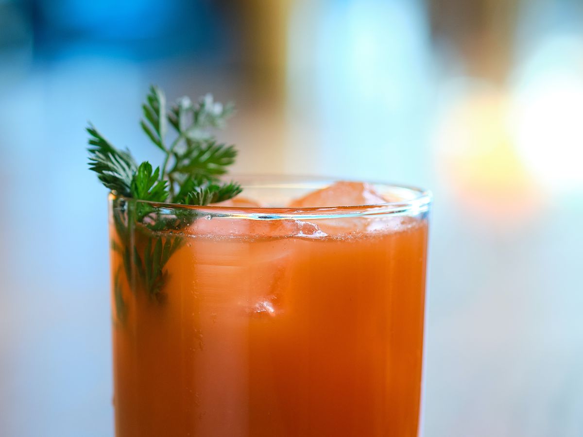 Carrot cocktail on wood table.