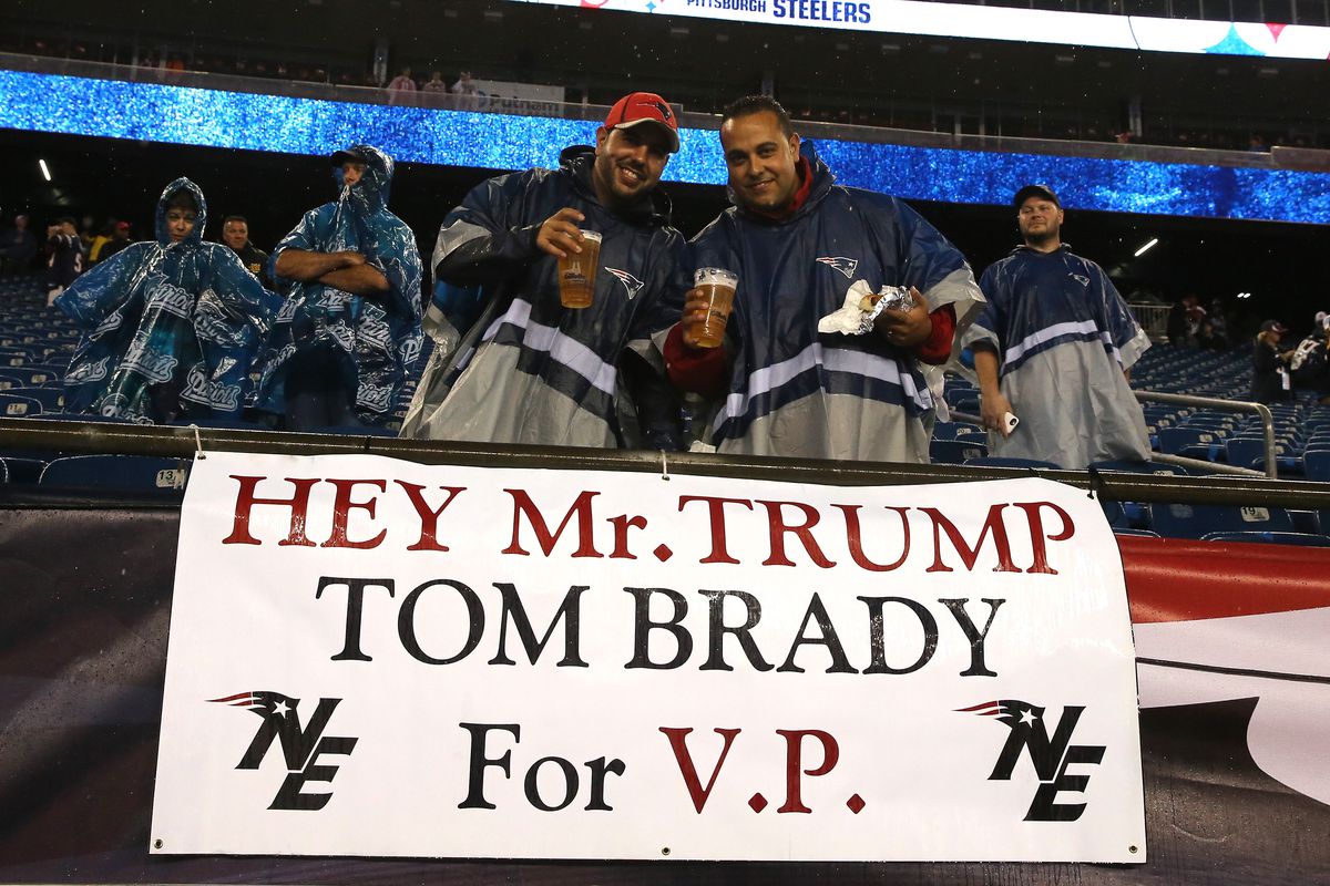 Fans stand with a sign stating 'Hey Mr. Trump Tom Brady for V.P.' before the game between the New England Patriots and the Pittsburgh Steelers at Gillette Stadium.