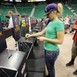 Emily Dziatlik makes her pick of Trey Burke as she joins other Utah Jazz fans at the team's 2013 NBA draft party at EnergySolutions Arena on Thursday, June 27, 2013.